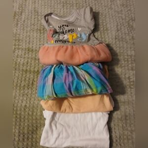 Newborn Bunble. 2 Addorable Dresses. 1 Onsie and 1 Shirt.